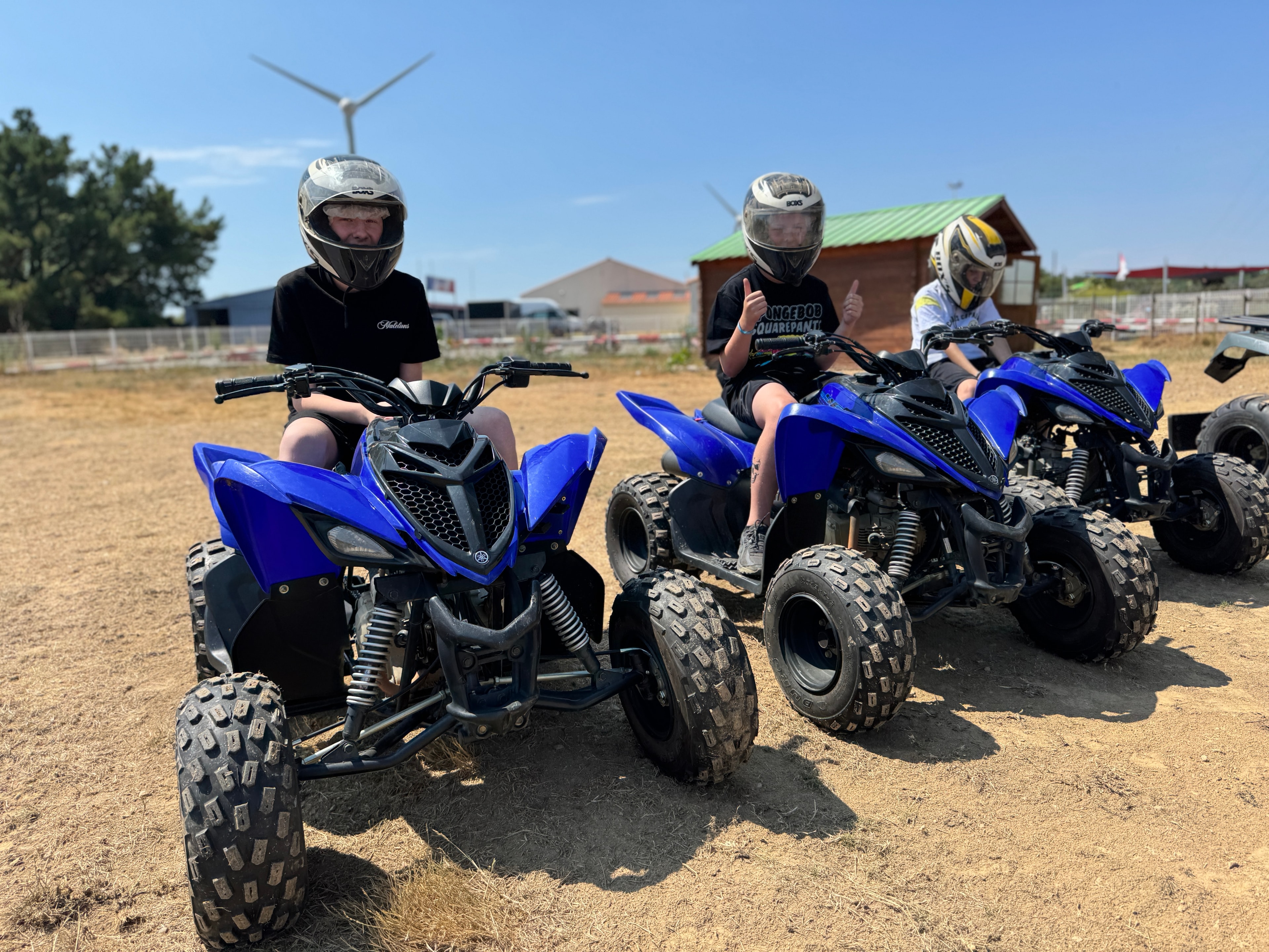 Quad riding with helmets on